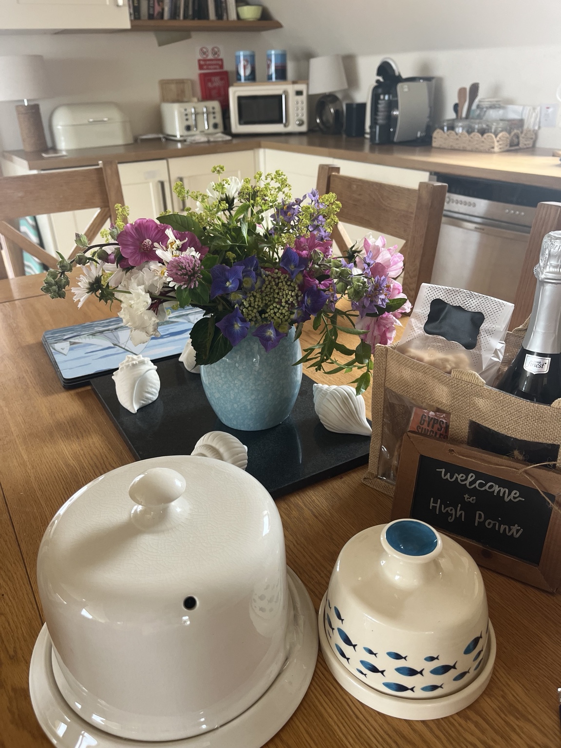 Welcome goodies and fresh flowers waiting for guests in The Sunset Loft