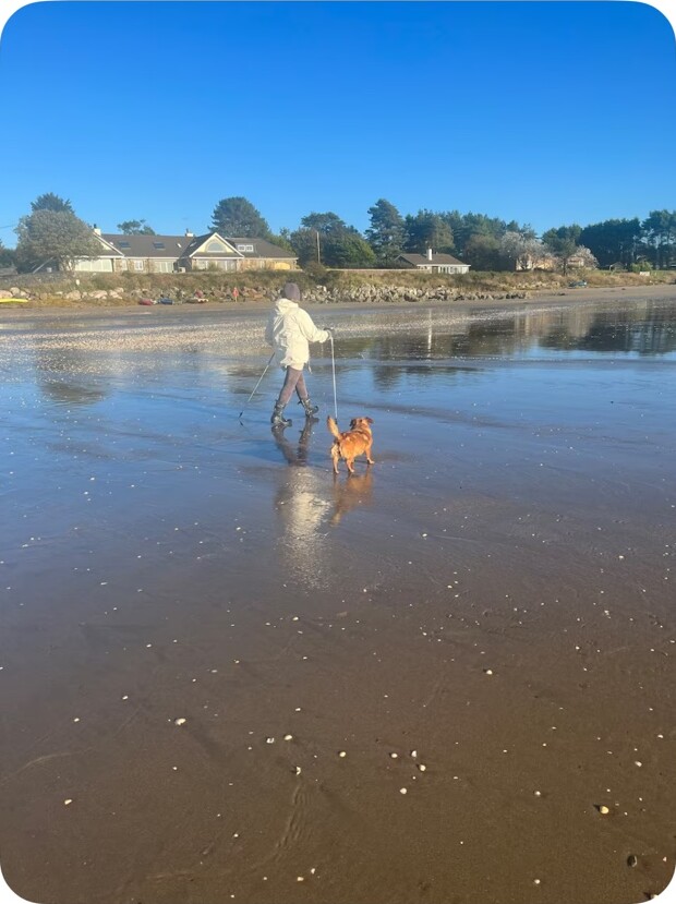 Walking a dog on Sandgreen Beach in September